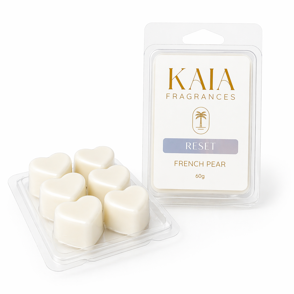 Heart-shaped wax melts in a clear container with 'KAIA FRAGRANCES' packaging on a white background.