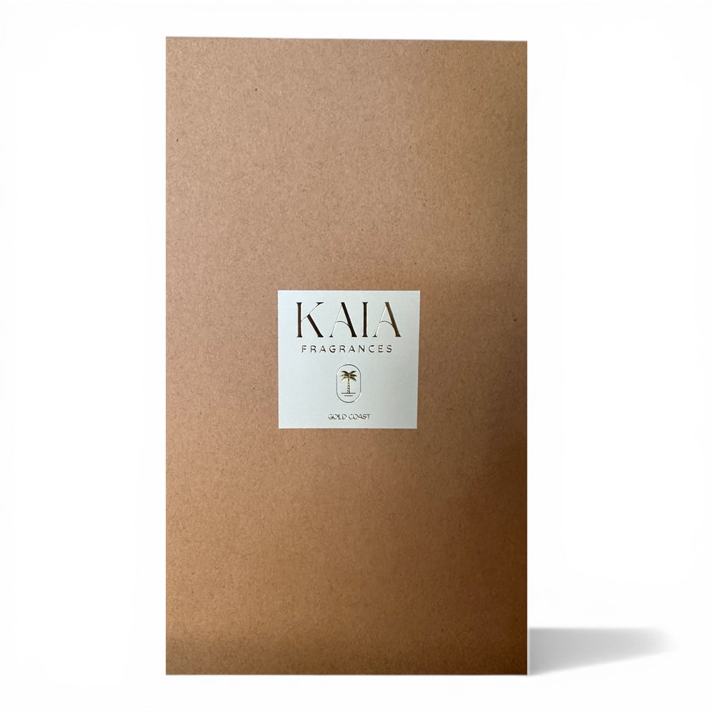 Kraft brown box with a white label featuring 'KAIA FRAGRANCES' on a white background