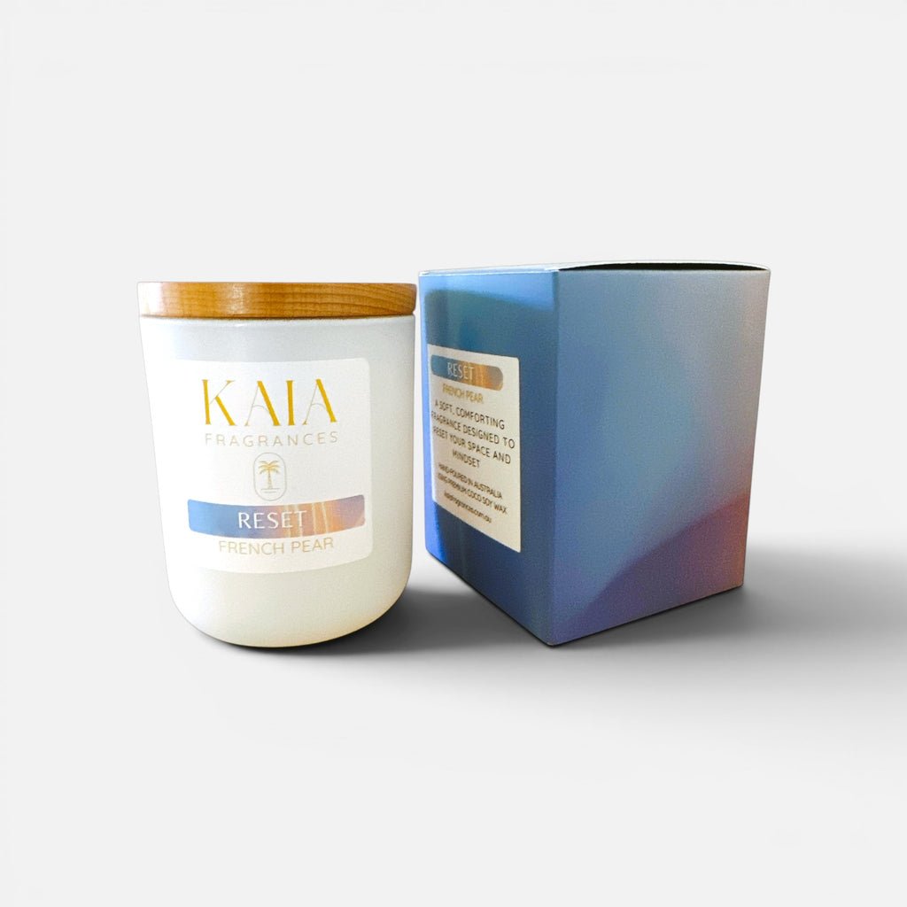 KAIA Candle with wooden lid and packaging on a white background