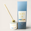 KAIA Reset Reed diffuser with gold accents and packaging on a white background