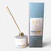 KAIA Focus Reed diffuser with gold sticks and packaging on a white background