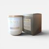 Candle and its packaging with 'KAIA' branding on a white background