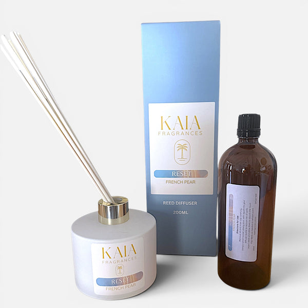 KAIA Fragrances reed diffuser refill set and bottle with packaging on a white background