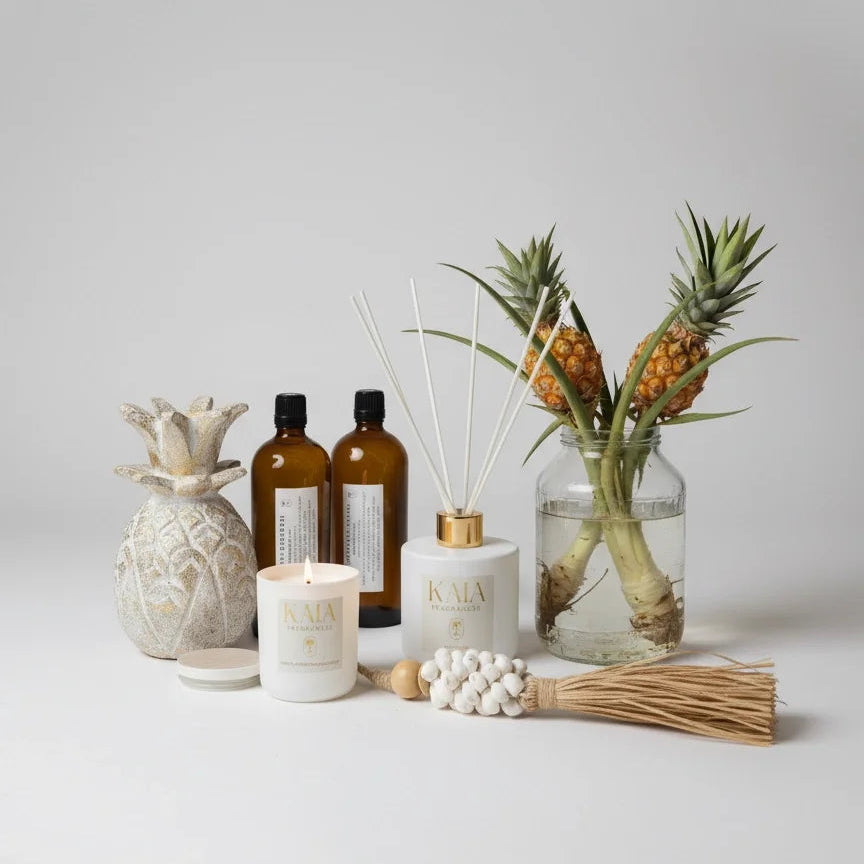 Decorative items including bottles, a candle, and a vase with plants on a light background